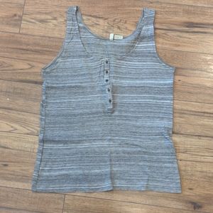 Covet tank top. Fits more like a looser small.
